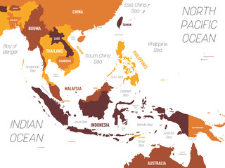 Southeast Asia map - brown orange hue colored on dark background. High detailed political map of southeastern region with country, ocean and sea names labeling