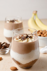 Chia seeds pudding with chocolate and banana smoothie in a glass