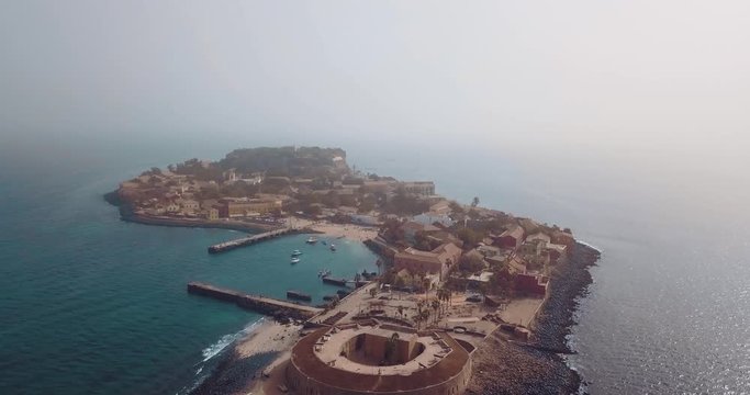 the island gore from which slaves were exported from Africa, turquoise water and yellow sand photographed from the air
