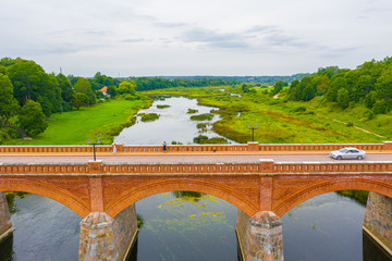 Beautiful panoramic aerial view photo from flying drone to Venta Rapid waterfall,the widest...