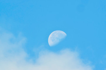 Obraz na płótnie Canvas The moon And beautiful sky clouds