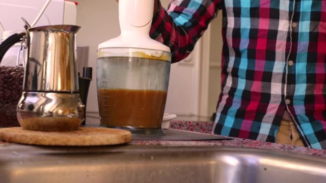 Person making bulletproof coffee with butter and MCT oil - 8 sec