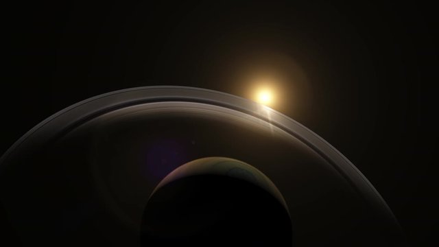 Slowly orbiting around the gas giant Saturn with the rings gradually catching the light from the bright sun concept
