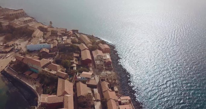 the island gore from which slaves were exported from Africa, turquoise water and yellow sand photographed from the air