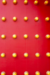 Old Chinese red wooden door background in the temple palace