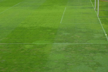 Obraz na płótnie Canvas Green football field with nobody