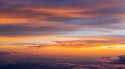 Sunset sky background vivid color sky background. view from plane.
