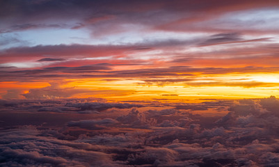 Fototapeta na wymiar Sunset sky background vivid color sky background. view from plane.