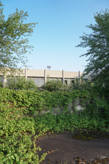 Fototapeta premium Ruins of abandoned buildings in 1986. Soviet architecture in Chernobyl. Danger of infection of people with the virus, radiation. Scary Grunge Background