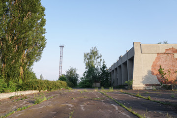 Ruins of abandoned buildings in 1986. Soviet architecture in Chernobyl. Danger of infection of...