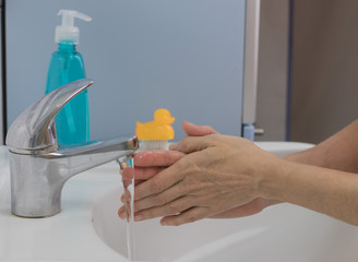 Hand washing with warm water and soap to prevent becoming infected with COVID-19