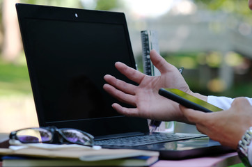 female hands typing on laptop