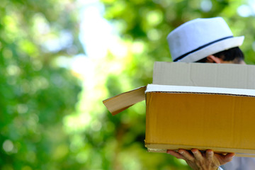 Delivery Man holding a cardboard box and space for text