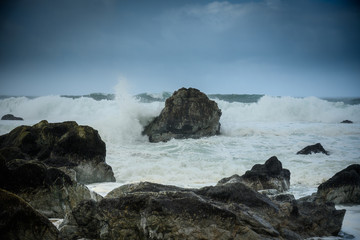 Fototapeta na wymiar Wave Crashes On Submerged Rock