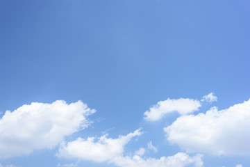 Naklejka na ściany i meble White clouds on blue sky