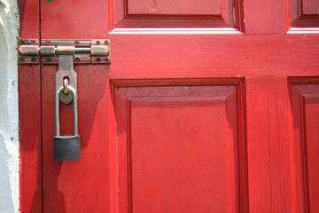 red door with metallic lock and handle