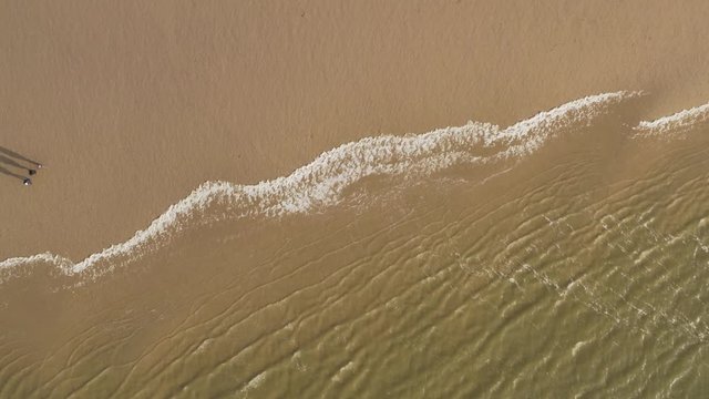 Aerial panoramic view over the Port and Seaside of Cuxhaven with a big Container Ship in the distance on the North Sea