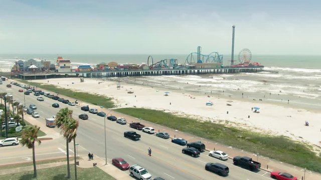 Galveston, Texas, USA. 1 October 2019. Holiday beach town & the Galveston Island Historic Pleasure Pier in the gulf of Mexico.