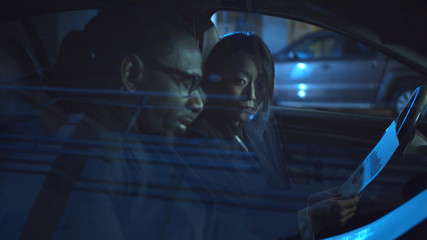 Man and woman discuss business in car. Medium close-up