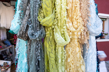 Sample of lace scarves hanging in a store in Burano, Italy