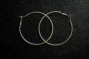 silver hoops with black leather bottom