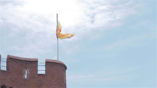 Catala flag fly at the top of Castillet in Perpignan catalunya nord