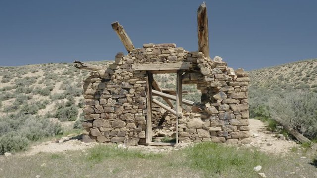 Aerial: Abandoned shack in the desert in the old mining town of Ely.  Nevada, USA