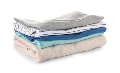 Stack of clean clothes on white background