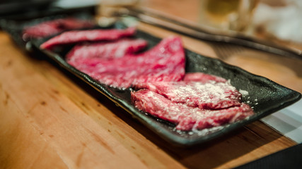 Wagyu beef raw sliced served for japanese barbecue of Sukiyaki. Yakiniku
