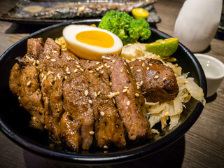 Set of delicious traditional skewers grilled and rice bowl of donburi.