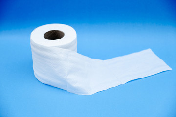 Toilet paper isolated on a blue background