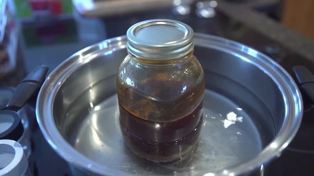 Medical Cannabis Heated And Extracted For Homemade Salve And Oil Production - medium shot