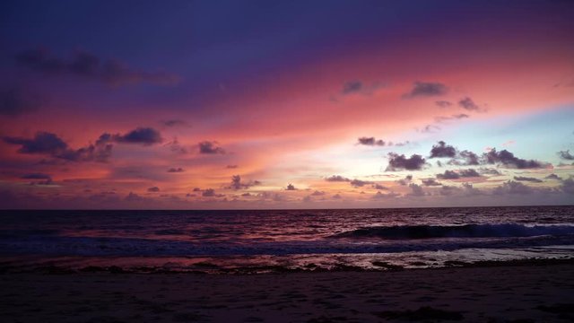 Stunningly gorgeous colorful pink and red sunrise at the tropical exotic Tabatinga beach near Joao Pessoa, Brazil