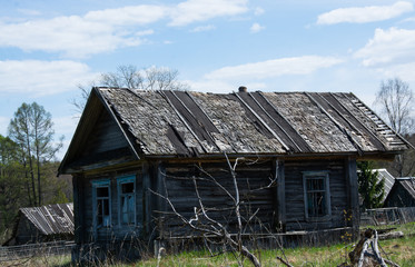 Destroyed wooden house in the village