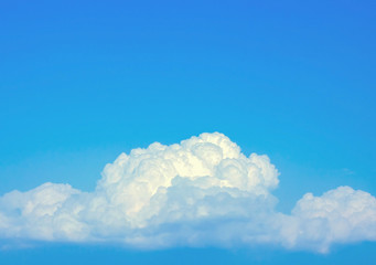 fluffy soft cloudy in dim blue sky with copy space
