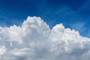 white fluffy cloudy in overcast blue sky