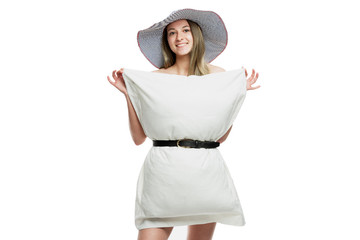 Pillow Challenge. Smiling girl in a hat and a white pillowcase. Flash mob during the period of the coronavirus pandemic. Isolated on a white background.