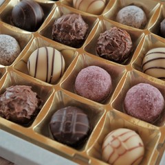 chocolate candy set. Round chocolate and fruit truffles. Box of  chocolates close-up .assorted chocolate sweets.Chocolate candies  in an open box. top view. sweet dessert. 