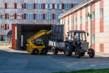 The front-end loader loads coal into a tractor trailer. Barnaul, Altai Territory, Russia