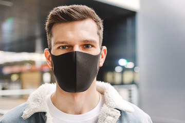 portrait of a guy in a medical mask.