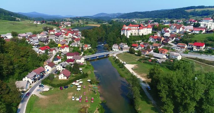 idyllic and charming aerial forward of Zuzemberk town and Krka River