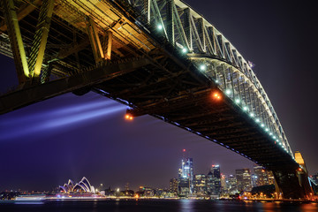 View of Sydney Harbour Bridge and Opera House from Milsons Point at night.