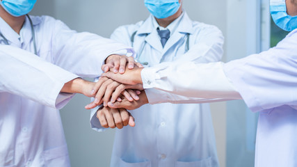 Close up Group hands of Doctors and nurses coordinate hands. Teamwork in hospital for success work and trust in team, harmoniousness, Doctors success banner background Concept.