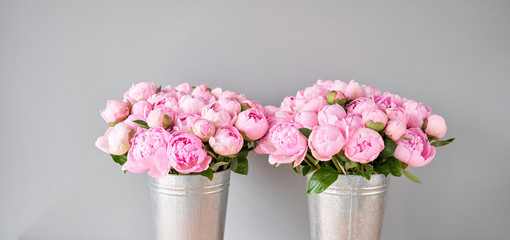 Pink Angel Cheeks peonies in a metal vase. Beautiful peony flower for catalog or online store. Floral shop concept . Beautiful fresh cut bouquet. Flowers delivery