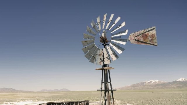 Aerial: Flying over a weather vane on an abandoned ranch. Ely, Nevada, USA