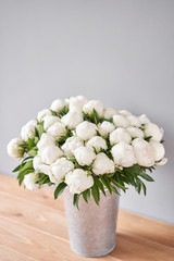 White Madame Claude Tain peonies in a metal vase. Beautiful peony flower for catalog or online store. Floral shop concept . Beautiful fresh cut bouquet. Flowers delivery