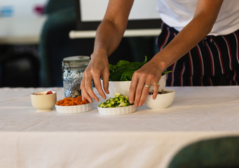 Woman hands preparing food of a presentation table
