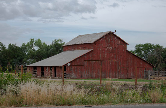 Old red barn in a field