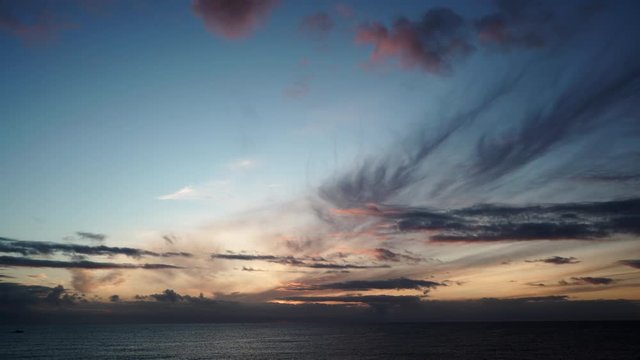 Seascape at early morning, first light. Time lapse of clouds moving over sea at sunrise dawn. Nature landscape in Spain