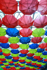 Fototapeta na wymiar colourful umbrellas look like a colourful sky
